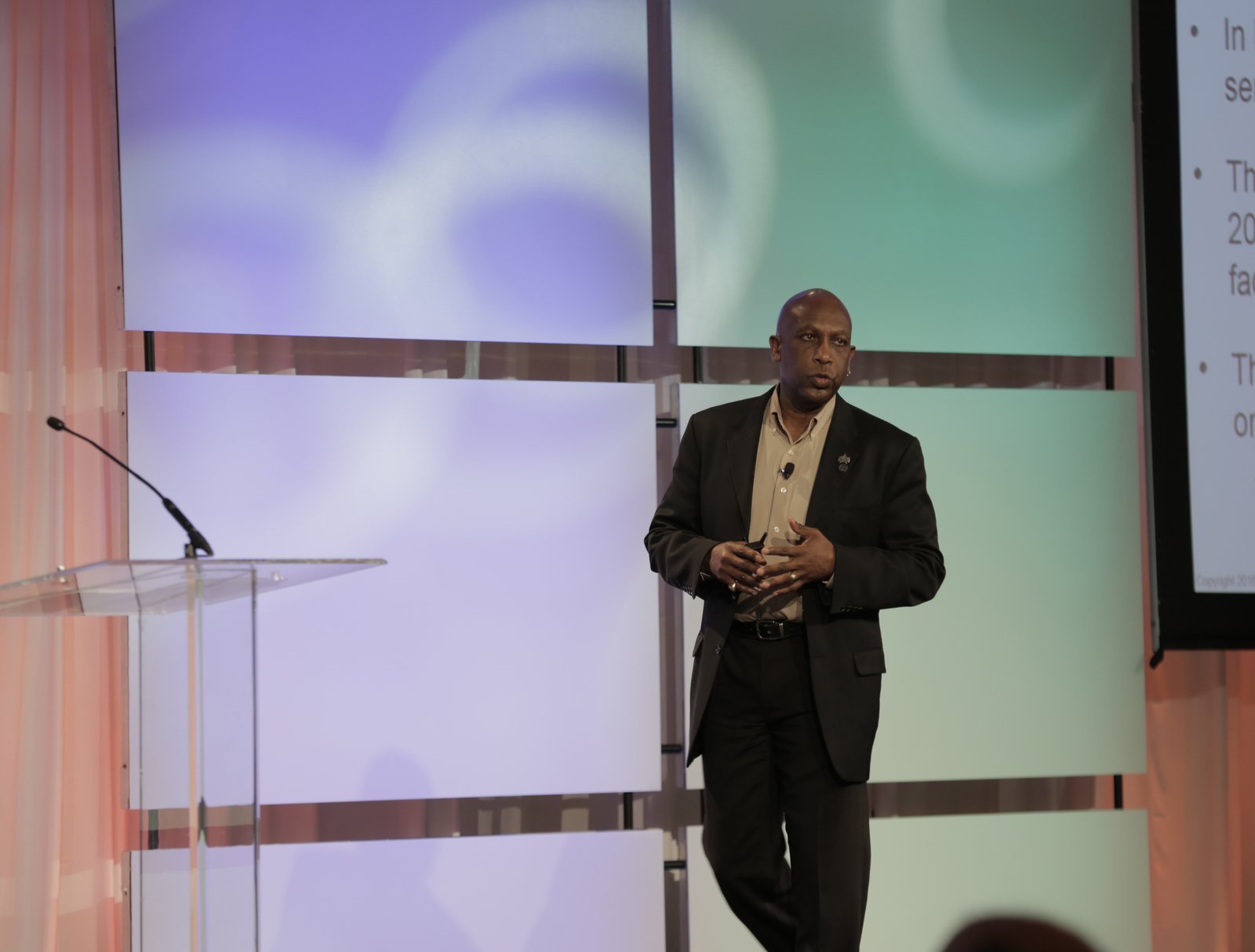 Anthony King speaking on stage at the Manufacturing Leadership Summit